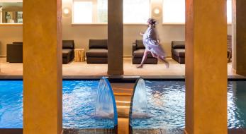 A woman at the indoor pool